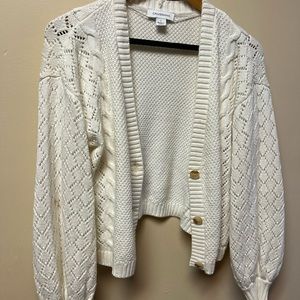 Cream knit sweater. Great detail.